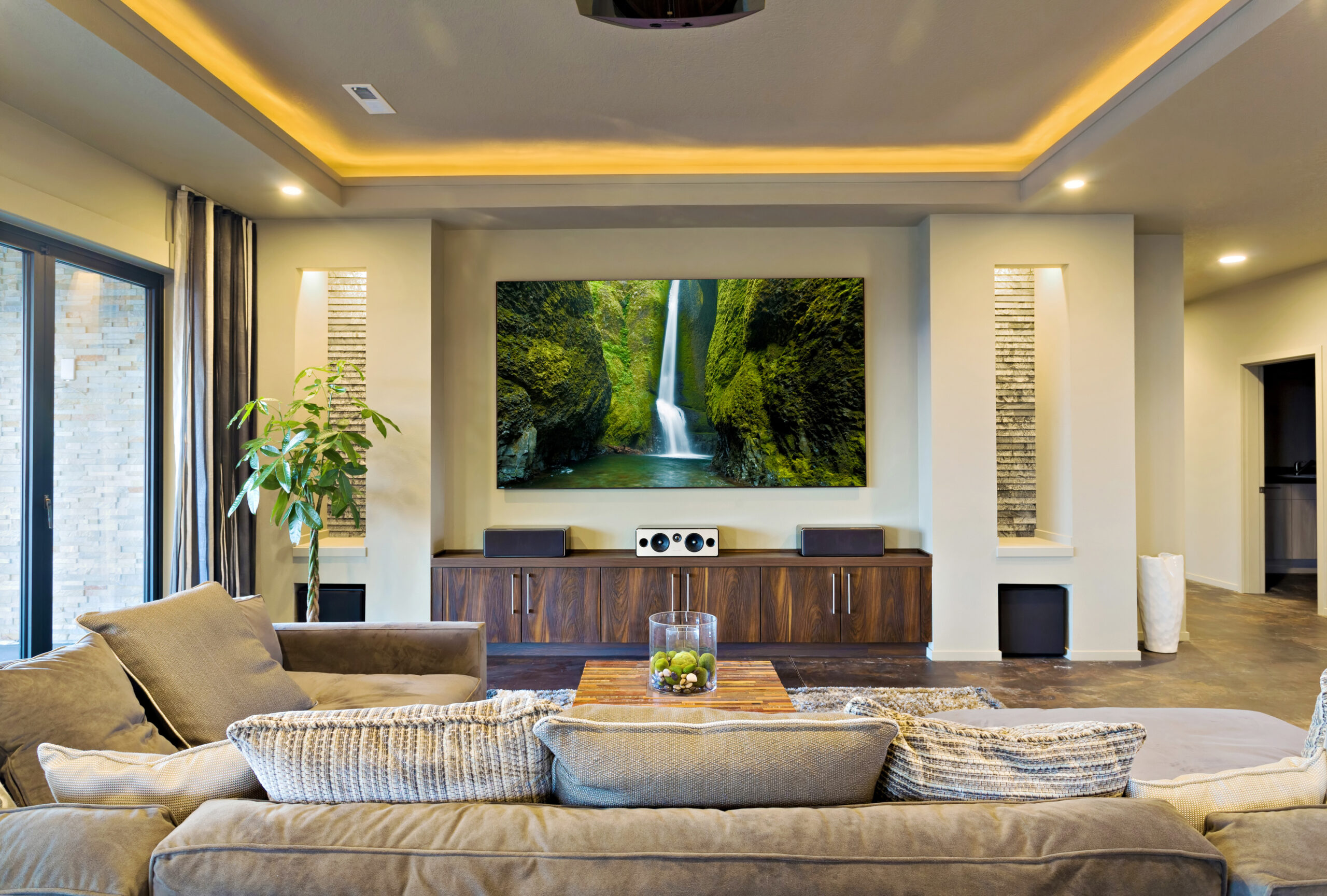 Built-in media wall with TV and speakers for a Fort Collins home